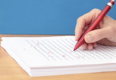 manuscript-being-corrected-red-pen