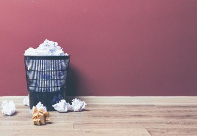 Discarded drafts Waste paper in a bin