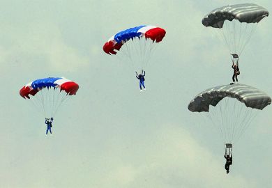 People using parachutes. To illustrate people being placed in to new senior management roles to tackle big issues such as sustainability and diversity.