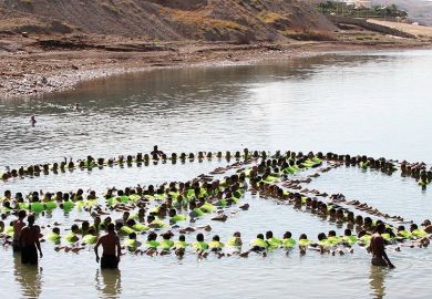 people make the shape of a peace sign in the water