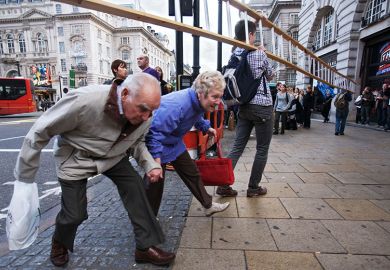 Pensioners lowering themselves to walk under a ladder. To illustrate that employer contribution rates to the Teachers’ Pension Scheme (TPS) may fall by as much as 10 per cent next year. Pensioners lowering themselves to walk under a ladder. To illustrate that employer contribution rates to the Teachers’ Pension Scheme (TPS) may fall by as much as 10 per cent next year.