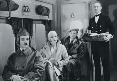 People being served in First Class train carriage