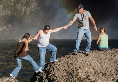 People climbing rocks, Snoqualmie Falls, Washington People climbing rocks, Snoqualmie Falls, Washington