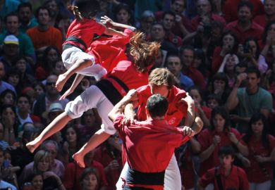 People collapse while building human tower