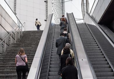 people going up escalator people going up escalator