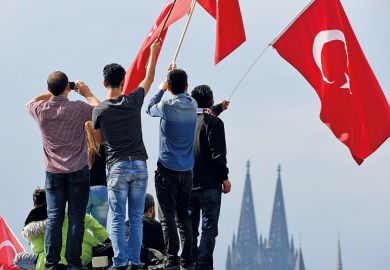 People waving Turkish flag