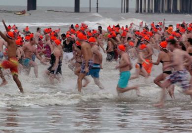 People Running To The Water On Dutch New Year's Div