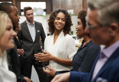 People standing and talking at a conference