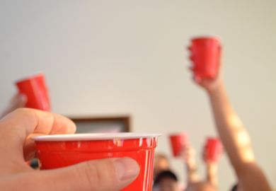 People toasting using red party cups