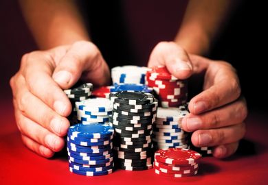 Person betting large amount of casino chips