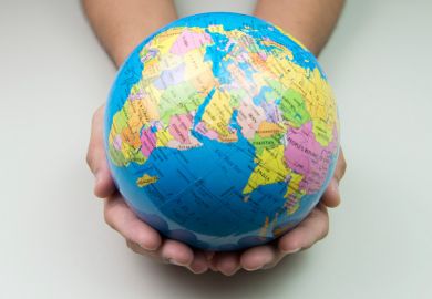 Person holding world in hands (university rankings)