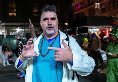 Person wearing a doctor's costume at the Halloween Parade in New York. To illustrate students obtaining fake doctor's notes. Person wearing a doctor's costume at the Halloween Parade in New York. To illustrate students obtaining fake doctor's notes.