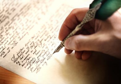 Person writing letter with metal quill