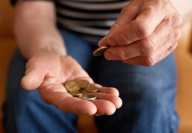 Person counting money in hand