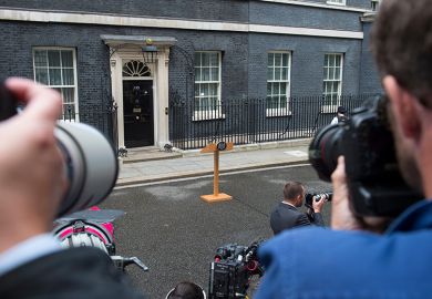 Photographers waiting for an announcement with empty lectern outside Downing Street. To illustrate that universities waiting for government intervention are likely to be disappointed. Photographers waiting for an announcement with empty lectern outside Downing Street. To illustrate that universities waiting for government intervention are likely to be disappointed.