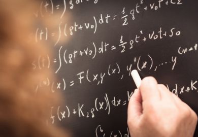 Physics teacher writing