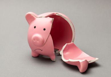 A broken piggy bank, symbolising in adequate master's loans