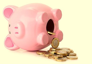 A piggy bank on its side with coins pouring our, illustrating pension unsustainability