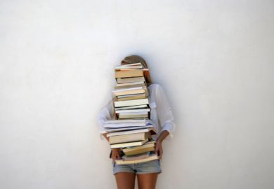 Student with pile of books