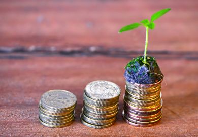 Piles of coins increasing in size (pension/savings)