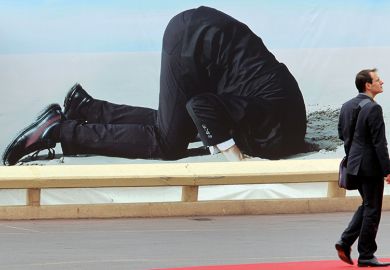 Poster of man with head buried in sand