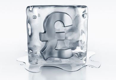 Pound currency symbol frozen in ice block