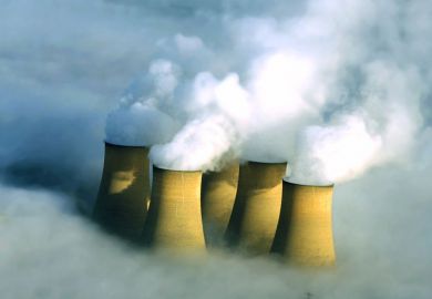 Power station chimneys engulfed in fog