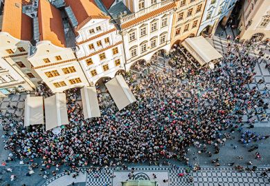 Aerial view of crowd in a square in Prague, Czech Republic to illustrate increasing international student mobility in Europe Aerial view of crowd in a square in Prague, Czech Republic to illustrate increasing international student mobility in Europe