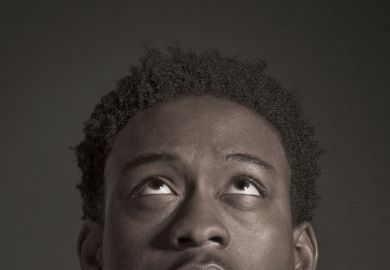 Profile of young male student looking up
