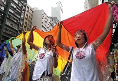 Demonstrators carry a giant rainbow flag in march against homophobia in Hong Kong, 2007 Demonstrators carry a giant rainbow flag in march against homophobia in Hong Kong, 2007