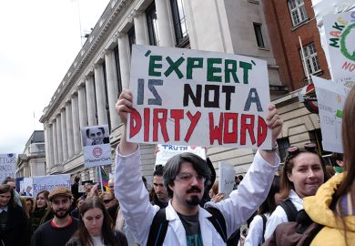 Protesters carrying signs