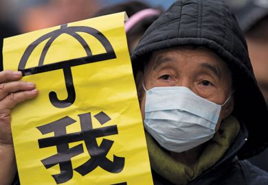 Protestor holding banner, Admiralty District, Hong Kong Protestor holding banner, Admiralty District, Hong Kong