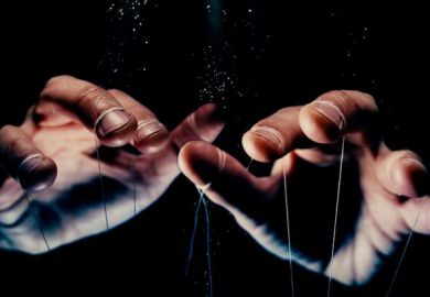 A puppeteer's hands, symbolising government control 