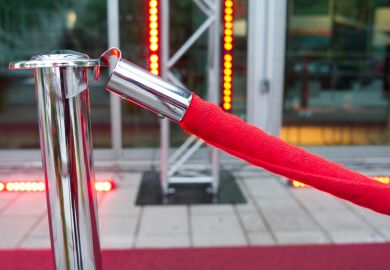 Red velvet ropes outside VIP event venue