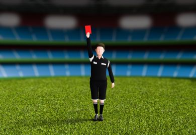 A football referee issues a red card