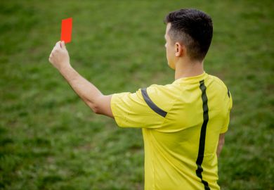 Referee showing a red card