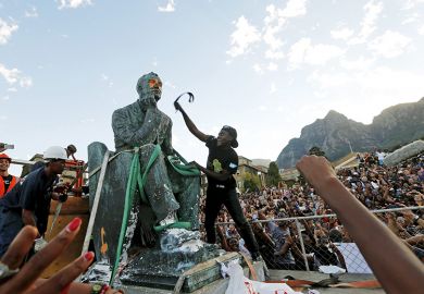 Activists deface a statue of Cecil John Rhodes at UCT