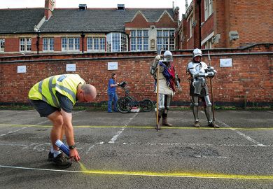 Claire Graham uses ground penetration radar (GPR) at Greyfriars car park in Leicester watched by actors dressed as Knights from Historic Equitation Ltd during an archaeological search for the lost grave of Richard III
