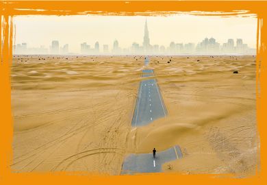 aerial view of an unidentified person walking on a deserted road covered by sand dunes in the middle of the Dubai desert.  Dubai, United Arab Emirates.
