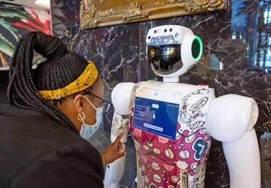 A woman interacts with robot in Johannesburg, South Africa. To illustrate that Africa has a crucial role in advancing the study of AI. A woman interacts with robot in Johannesburg, South Africa. To illustrate that Africa has a crucial role in advancing the study of AI.