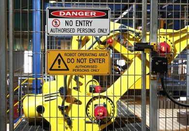 Warning signs outside a robotic assembly line, symbolising restrictions on AI use in research Warning signs outside a robotic assembly line, symbolising restrictions on AI use in research