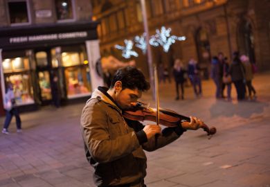 Roma youth playing violin Roma youth playing violin