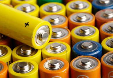 Rows of multi-coloured AA batteries
