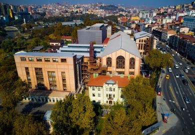 One of three campuses of İstanbul Bilgi University, located next to a busy road