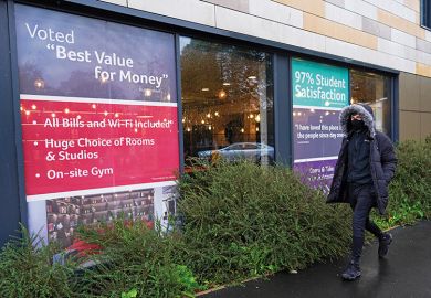 Man walks past office renting student accommodation illustrating education’s value for money