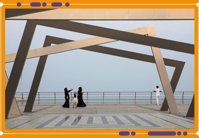 Women wearing chadors walk past an art installation on the corniche promenade in Dhahran, Saudi Arabia. Women wearing chadors walk past an art installation on the corniche promenade in Dhahran, Saudi Arabia.