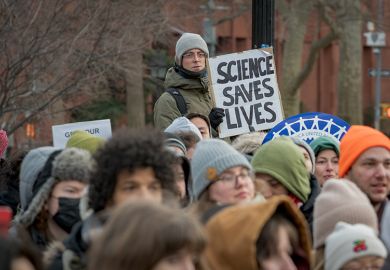 Participant seen holding a sign as hundreds of Academic Workers gathered at Washington Square Park in Manhattan for a protest against the Trump administration's freezing of public funding for science research, 19 February 2025