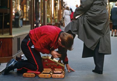 Shoeshine boy polishing man's shoes Shoeshine boy polishing man's shoes