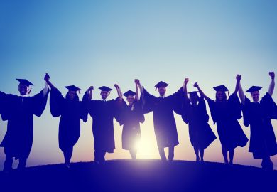 Students holding hands