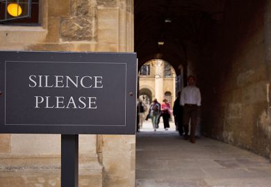 Silence please sign at university, UK. To illustrate free speech fears as campus critics are denied emeritus status.